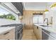 Gourmet kitchen featuring stainless steel appliances, a gas range, and custom wood cabinetry at 7706 Ficquette Rd, Windermere, FL 34786