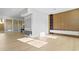 Modern living room with wood accent wall, light hardwood floors, recessed lighting, and sliding glass doors to the exterior at 7706 Ficquette Rd, Windermere, FL 34786