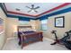 Well-lit bedroom with a ceiling fan, Peloton exercise bike, and stylish decor for a modern lifestyle at 8335 Lake Burden Circle, Windermere, FL 34786