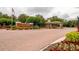 Welcoming entrance to Keene's Pointe featuring manicured landscaping and a secure gatehouse, enhancing the community's appeal at 8335 Lake Burden Circle, Windermere, FL 34786
