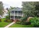 Charming two-story home with double front porches and manicured landscaping at 8335 Lake Burden Circle, Windermere, FL 34786