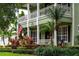 Inviting front porch with American flag and well-maintained landscaping at 8335 Lake Burden Circle, Windermere, FL 34786