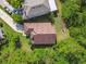 Aerial view of the home's roof in a community with lush greenery at 848 Magnolia Creek Cir, Orlando, FL 32828