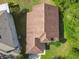 A top-down aerial view showcasing the house with an expansive brown roof and green lawn at 848 Magnolia Creek Cir, Orlando, FL 32828