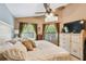 Comfortable bedroom with ample natural light, ceiling fan and neutral tones at 848 Magnolia Creek Cir, Orlando, FL 32828