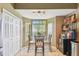 Breakfast nook features a glass table, tiled floors, and a storage closet at 848 Magnolia Creek Cir, Orlando, FL 32828