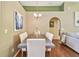 Formal dining room featuring hardwood floors, chandelier, and neutral decor at 848 Magnolia Creek Cir, Orlando, FL 32828