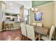 Open-concept dining area with hardwood floors and convenient breakfast bar access at 848 Magnolia Creek Cir, Orlando, FL 32828