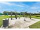 A public fitness area features exercise equipment, tennis courts and walking paths at 848 Magnolia Creek Cir, Orlando, FL 32828