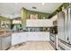 Bright kitchen featuring white cabinets, stainless steel appliances, and an open layout at 848 Magnolia Creek Cir, Orlando, FL 32828
