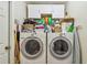 Bright laundry room with a washer, dryer, and ample storage space at 848 Magnolia Creek Cir, Orlando, FL 32828