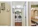 Laundry room with washer, dryer, and storage space seen through doorway at 848 Magnolia Creek Cir, Orlando, FL 32828