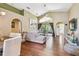 Spacious living room with wood floors, sectional sofa, and vaulted ceilings at 848 Magnolia Creek Cir, Orlando, FL 32828