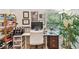 Well-lit home office with a modern desk setup and decorative shelving at 848 Magnolia Creek Cir, Orlando, FL 32828