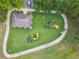 Aerial view of a community playground and lush landscaping at 848 Magnolia Creek Cir, Orlando, FL 32828