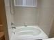 Bright bathroom featuring a tub and shower at 8608 Falstaff Pl, Oviedo, FL 32765