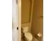 Compact bathroom featuring a toilet, a built-in shelf, and a toilet paper holder at 8608 Falstaff Pl, Oviedo, FL 32765