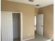 Bedroom featuring neutral colored walls, carpet, and closet at 8608 Falstaff Pl, Oviedo, FL 32765
