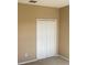 Bedroom featuring neutral colored walls, carpet, and closet at 8608 Falstaff Pl, Oviedo, FL 32765