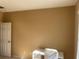 Bright room with beige walls, neutral carpet and a white door at 8608 Falstaff Pl, Oviedo, FL 32765