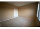 Bright bedroom with neutral carpeting, a double door closet, and a large window at 8608 Falstaff Pl, Oviedo, FL 32765