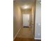 Welcoming hallway with tile flooring, leading to a white front door at 8608 Falstaff Pl, Oviedo, FL 32765