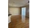 Bright living room featuring hardwood floors and sliding glass doors at 8608 Falstaff Pl, Oviedo, FL 32765