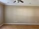 Bright living room with wood floor and ceiling fan at 8608 Falstaff Pl, Oviedo, FL 32765