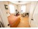 Cozy bedroom with a dedicated workspace and ample natural light from the windows at 920 Timor Ave, Orlando, FL 32804