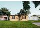 Charming home with an expansive lawn and a minimalist landscape design at 920 Timor Ave, Orlando, FL 32804