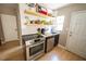 Modern kitchen featuring stainless steel appliances, subway tile backsplash, and open shelving at 920 Timor Ave, Orlando, FL 32804