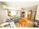 Bright living room with light wood floors, comfortable sectional sofa, and modern decor at 920 Timor Ave, Orlando, FL 32804