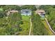 Beautiful waterfront home with boardwalk and luxurious landscaping, set amidst lush greenery at 9259 Tibet Pointe Cir, Windermere, FL 34786