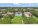 Aerial view of a luxurious property showcasing its manicured lawn and peaceful neighborhood setting at 9259 Tibet Pointe Cir, Windermere, FL 34786