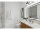 Modern bathroom featuring a marble vanity, illuminated mirror, and stylish finishes at 9259 Tibet Pointe Cir, Windermere, FL 34786