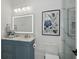 Elegant bathroom with a vanity, illuminated mirror, and luxurious finishes at 9259 Tibet Pointe Cir, Windermere, FL 34786