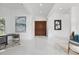 Grand foyer boasts high ceilings, elegant artwork, tile floors, and double doors, making a welcoming statement at 9259 Tibet Pointe Cir, Windermere, FL 34786