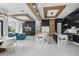 Modern kitchen with marble islands, black cabinetry, stainless steel appliances, and an open floor plan at 9259 Tibet Pointe Cir, Windermere, FL 34786