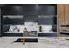 Gourmet kitchen featuring marble countertop, sleek black cabinetry, and stainless steel appliances including a modern gas range at 9259 Tibet Pointe Cir, Windermere, FL 34786