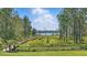 Scenic backyard with landscaped lawn and water views at 9259 Tibet Pointe Cir, Windermere, FL 34786