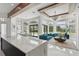 Bright, open-concept living room with ample natural light, a modern kitchen and a dining area with stylish furnishings at 9259 Tibet Pointe Cir, Windermere, FL 34786