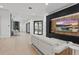 Spacious living room with a fireplace, TV, and comfortable seating at 9259 Tibet Pointe Cir, Windermere, FL 34786