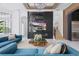 Stylish living room with modern decor, a marble fireplace, television, comfortable seating and elegant decor throughout at 9259 Tibet Pointe Cir, Windermere, FL 34786