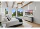 Inviting bedroom with pool view, featuring a large window, sleek console, and cozy decor at 9259 Tibet Pointe Cir, Windermere, FL 34786