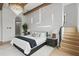 Stylish bedroom featuring modern accent wall, wood floors, and elegant lighting at 9259 Tibet Pointe Cir, Windermere, FL 34786