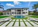 Expansive backyard with in-ground pool, patio and lounge chairs at 9259 Tibet Pointe Cir, Windermere, FL 34786