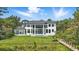 Rear exterior showcasing the pool, lawn, and outdoor living spaces at 9259 Tibet Pointe Cir, Windermere, FL 34786