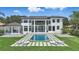 The rear of this property with a pool, green space and water views at 9259 Tibet Pointe Cir, Windermere, FL 34786