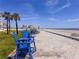 Inviting Beach access with outdoor lounging, palm trees, and ocean views at 935 S Atlantic Ave # 244, Daytona Beach, FL 32118