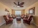 Inviting common area with comfortable seating arrangement, tiled floors, and decorative ceiling fan at 935 S Atlantic Ave # 244, Daytona Beach, FL 32118